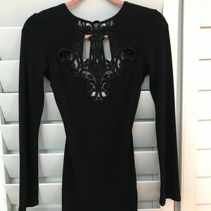 Stunning black mini dress w/ detail in front